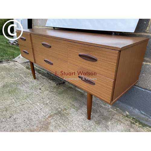 403 - A teak effect six drawer dressing chest