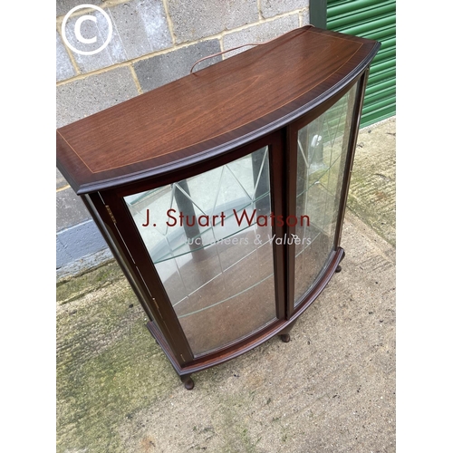 408 - A reproduction mahogany bow front china cabinet