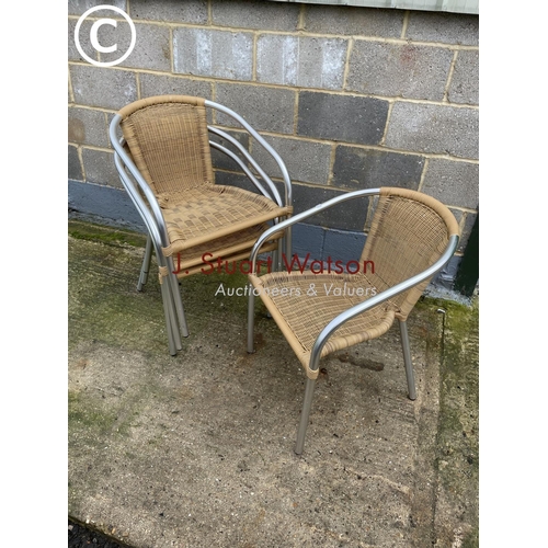 413 - A set of four aluminium stacking garden chairs