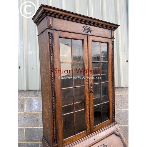 432 - A 20th century oak bureau bookcase