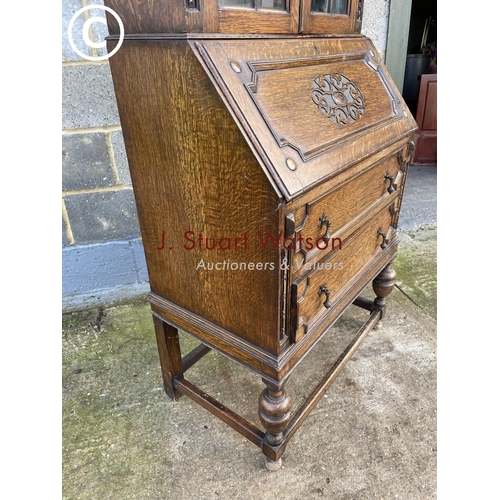 432 - A 20th century oak bureau bookcase