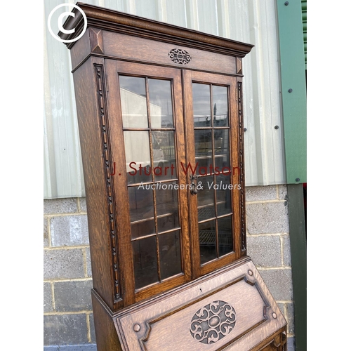 432 - A 20th century oak bureau bookcase