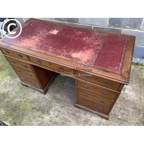 434 - A Victorian mahogany pedestal office desk with a red leather top