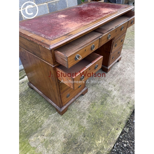 434 - A Victorian mahogany pedestal office desk with a red leather top