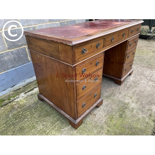 434 - A Victorian mahogany pedestal office desk with a red leather top