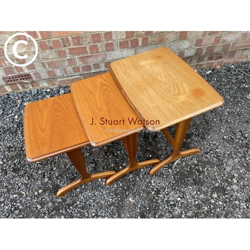 49 - A teak nest of three occasional tables