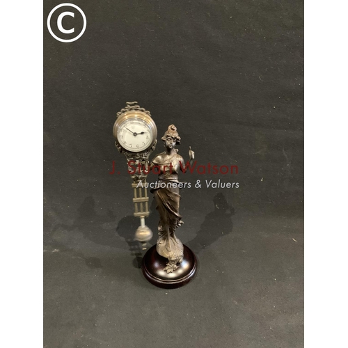 632 - Swinging Diana clock Overall height 33 cms