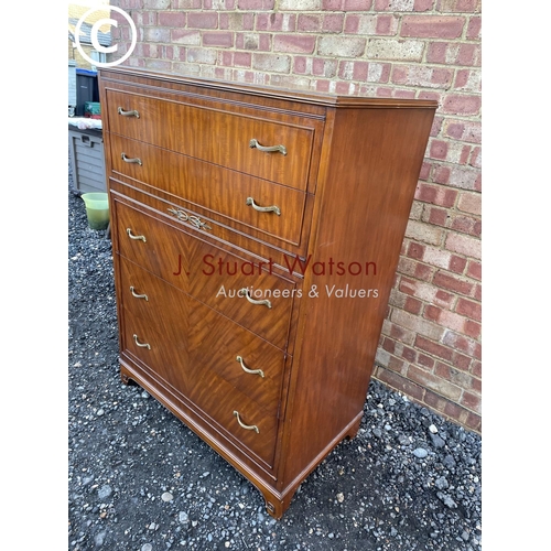 66 - An American mahogany tallboy chest of five drawers with ornate brass handles, labelled to the top dr... 