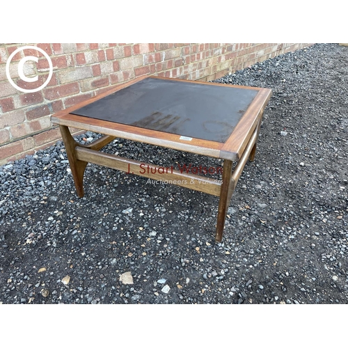 68 - A teak coffee tabke with a drop in glass top by stateroom