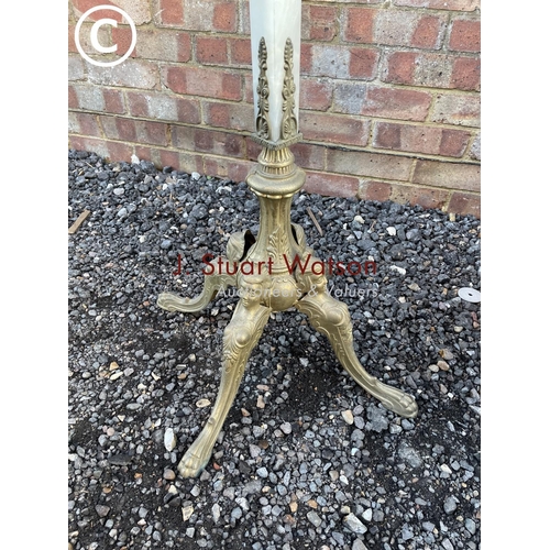 73 - A brass and onyx ornate coat stand 165cm tall