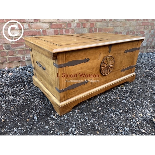 79 - A solid pine blanket box chest with metal bound corners