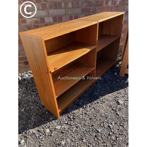 8 - A mid century teak gateleg table together with a teak open fronted bookcase