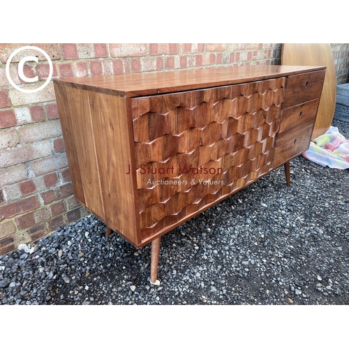 82 - An unusual hardwood sideboard by Swoon with three drawers and two doors