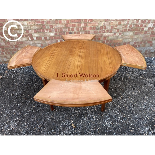 83 - A mid century teak extending  'Flip Flap' table by dyrlund with drawer leaf fold over extensions