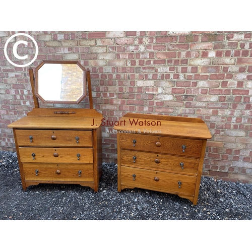 86 - A 20th century oak bedroom pair consisting of a three drawer dressing chest and a chest of three dra... 