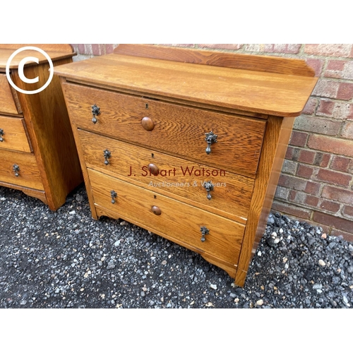 86 - A 20th century oak bedroom pair consisting of a three drawer dressing chest and a chest of three dra... 