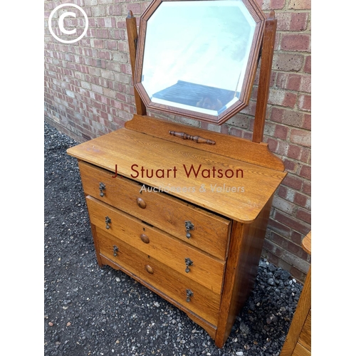 86 - A 20th century oak bedroom pair consisting of a three drawer dressing chest and a chest of three dra... 