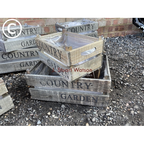 95 - Five sets of two graduated country garden crates