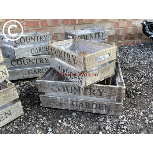 96 - Five sets of two graduated country garden crates