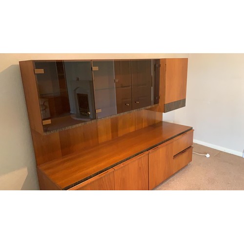 233 - A Macintosh teak sectional lounge unit with smoked glass front