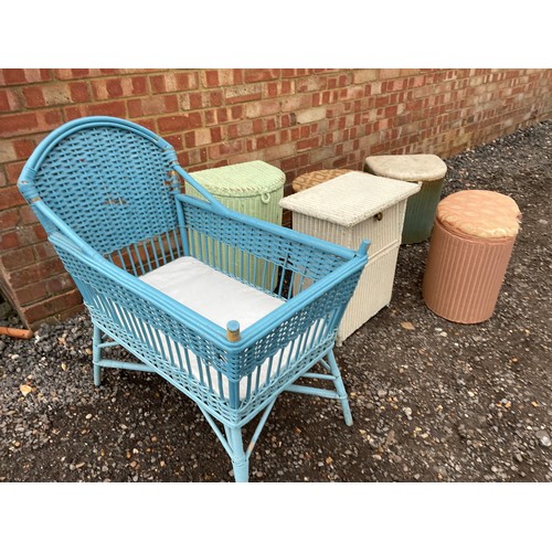 435 - A collection of LLoyd loom boxes together with a painted wicker crib