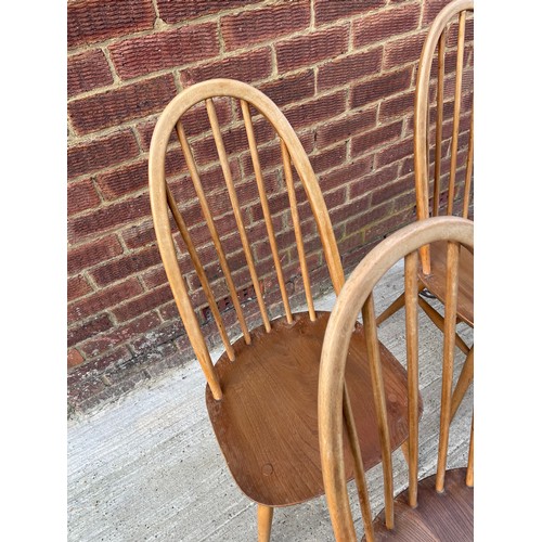 433 - A set of four Ercol stick back dining chairs