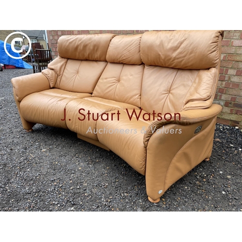 331 - A modern tan brown leather curved sofa by Himola of Germany with four way electric recline function ... 