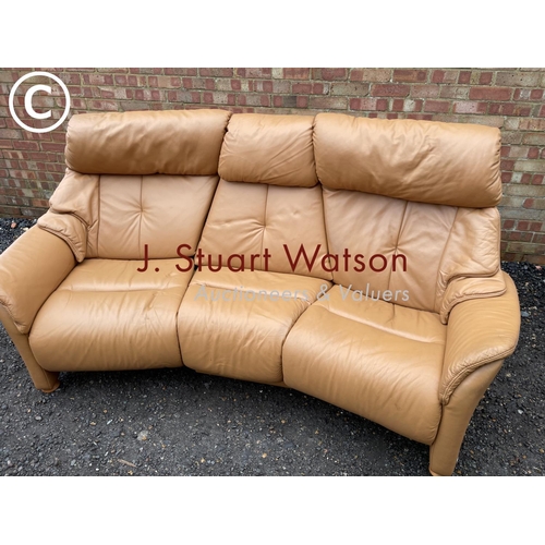 331 - A modern tan brown leather curved sofa by Himola of Germany with four way electric recline function ... 