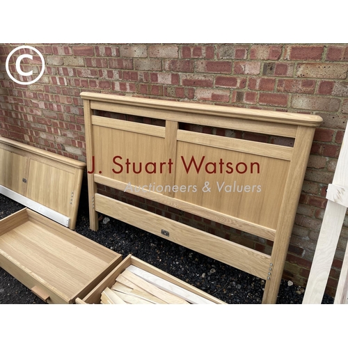 332 - A modern light oak double bed frame with two drawers, complete with all fixings, slats etc in excell... 