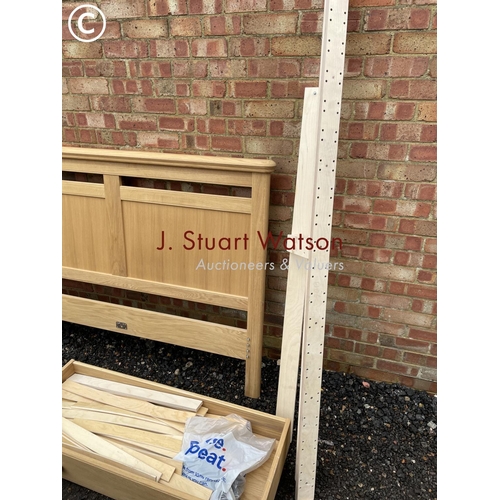 332 - A modern light oak double bed frame with two drawers, complete with all fixings, slats etc in excell... 