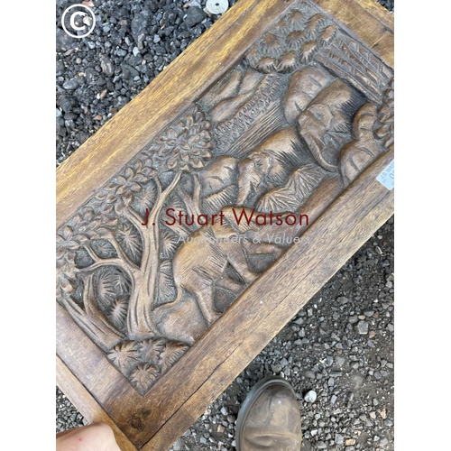 101 - A small hardwood box carved with elephant scenes