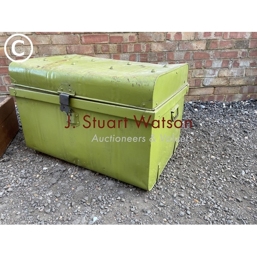 116 - A green tin trunk and a brown travelling trunk