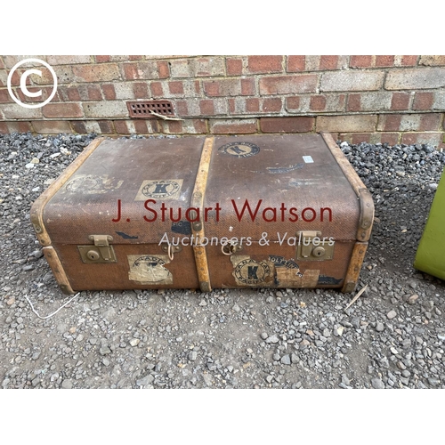 116 - A green tin trunk and a brown travelling trunk