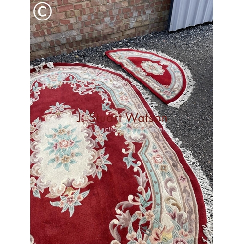 117 - A set of red pattern chinese carpets including very large oval