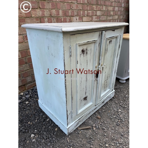 122 - A grey painted pine two door cupboard