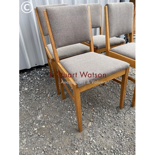 136 - A set of four  mid century dining chairs by Russell of broadway upholstered in grey material