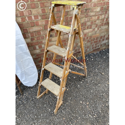 14 - A pair of vintage folding steps together with a vintage ironing board