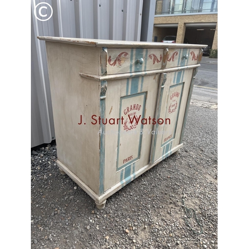 153 - A continental painted pine sideboard with two drawers over two cupboards