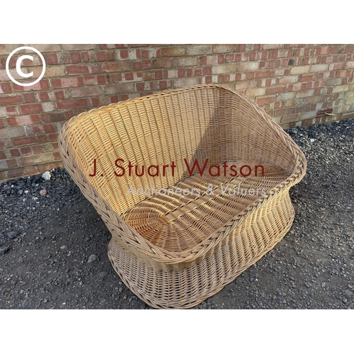 16 - A vintage wicker sofa