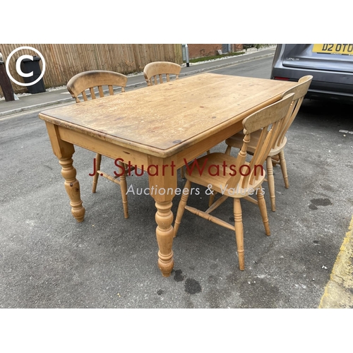 161 - A pine farmhouse table 180x96 together with four pine chairs