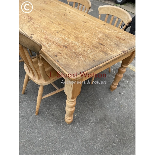 161 - A pine farmhouse table 180x96 together with four pine chairs