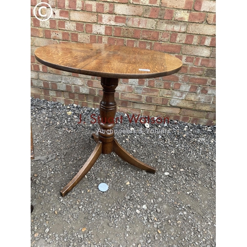 172 - An oak tripod table together with a small oak occasional table