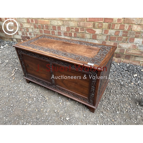 179 - A carved hardwood blanket box trunk