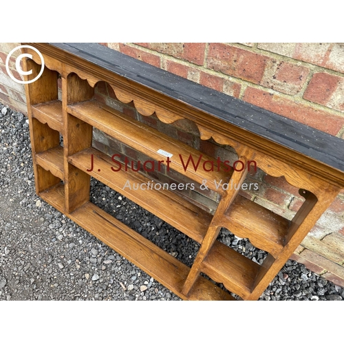 184 - An oak wall mounted plate rack