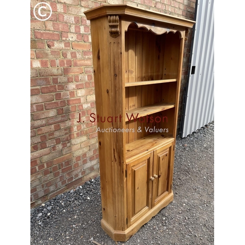 186 - An open fronted pine farmhouse style bookcase cupboard