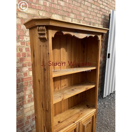 186 - An open fronted pine farmhouse style bookcase cupboard