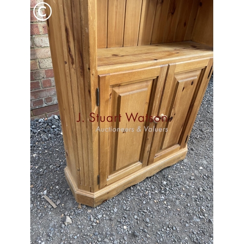 186 - An open fronted pine farmhouse style bookcase cupboard