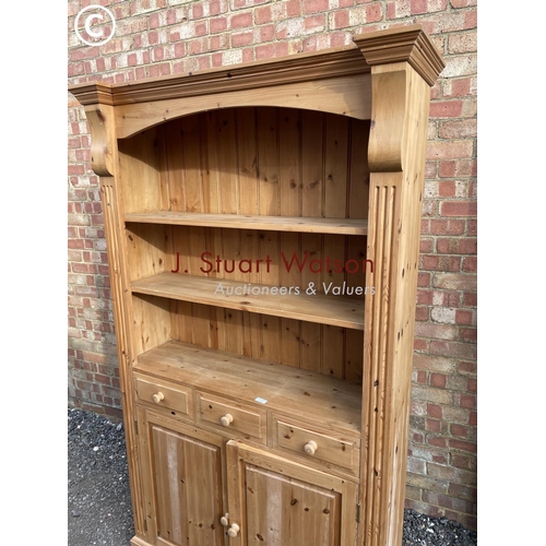 187 - An open fronted pine farmhouse style bookcase cupboard