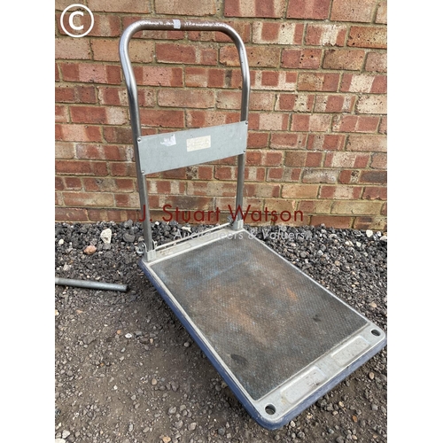 202 - A flat bed trolley and a steel frame sledge