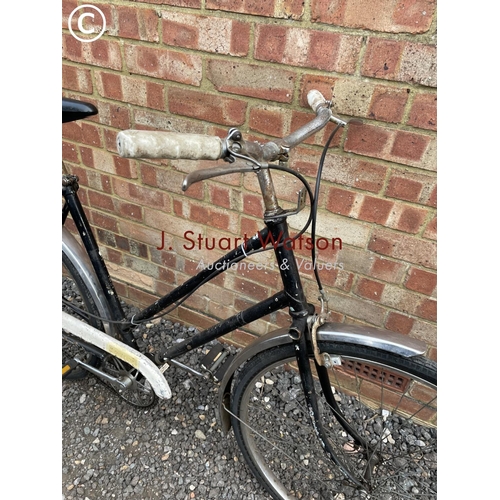 208 - A vintage black monochrome ladies cycle